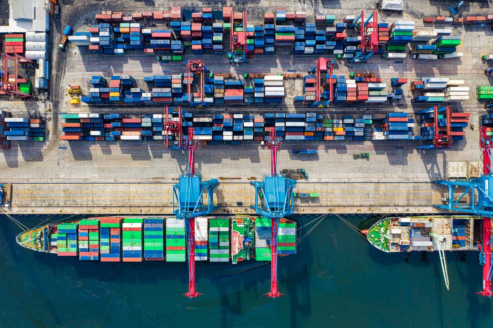 Container cranes working a vessel at berth